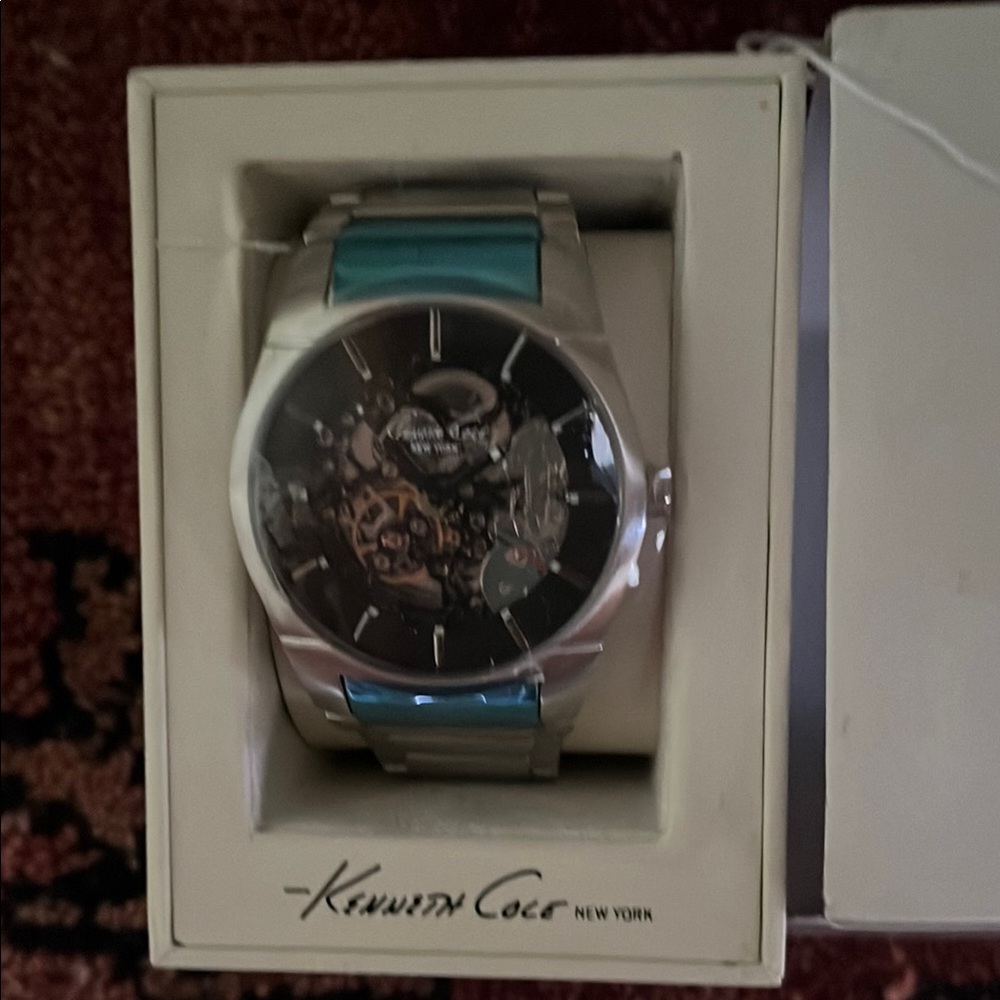 Kenneth Cole Silver Watch with Teal Accents